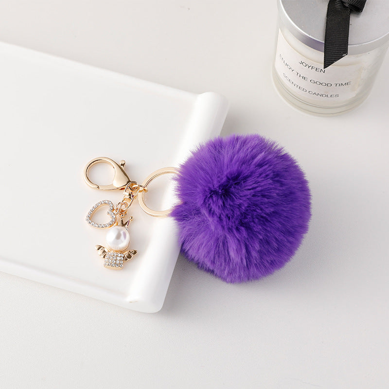 Wholesale of Cute Diamond Inlaid Angel Fur Ball Metal Keychains